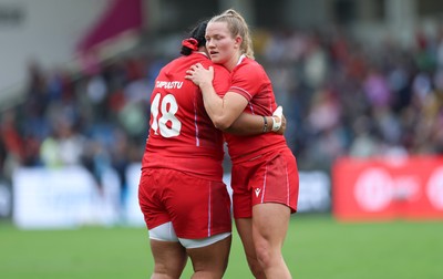230825 - Wales v Scotland, Women’s Rugby World Cup - Carys Cox of Wales and Sisilia Tuipulotu of Wales at the end of the match