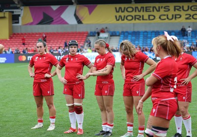 230825 - Wales v Scotland, Women’s Rugby World Cup - Courtney Keight of Wales, Bethan Lewis of Wales, Hannah Dallavalle of Wales and Carys Cox of Wales at the end of the match