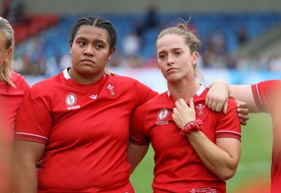 230825 - Wales v Scotland, Women’s Rugby World Cup - Sisilia Tuipulotu of Wales and Lisa Neumann of Wales at the end of the match