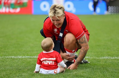 230825 - Wales v Scotland, Women’s Rugby World Cup - Donna Rose of Wales with daughter Margot at the end of the match