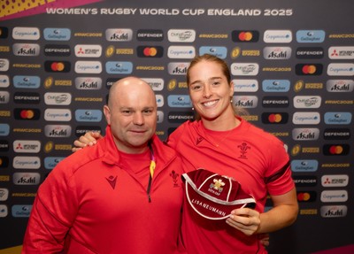 230825 - Wales v Scotland, Women’s Rugby World Cup - Lisa Neumann of Wales is presented with her 50th cap by Sean Lynn, Wales Women head coach
