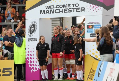 230825 - Wales v Scotland, Women’s Rugby World Cup - Lisa Neumann prepares to lead the team out on her 50th cap