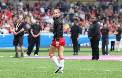 230825 - Wales v Scotland, Women’s Rugby World Cup - Lisa Neumann prepares to lead the team out on her 50th cap