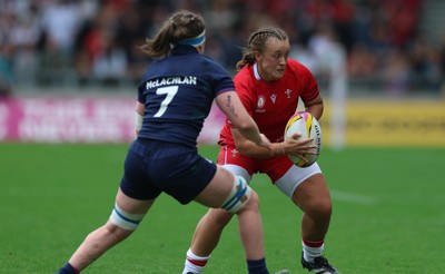 230825 - Wales v Scotland, Women’s Rugby World Cup - Lleucu George of Wales takes on Rachel McLachlan of Scotland