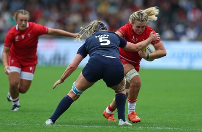 230825 - Wales v Scotland, Women’s Rugby World Cup - Alex Callender of Wales takes on Sarah Bonar of Scotland