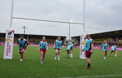 230825 - Wales v Scotland, Women’s Rugby World Cup - Jamie Cox works with the replacements as they warm up