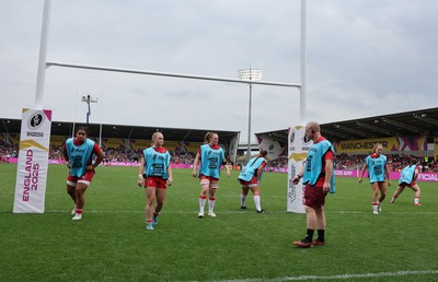 230825 - Wales v Scotland, Women’s Rugby World Cup - Jamie Cox works with the replacements as they warm up