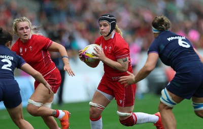 230825 - Wales v Scotland, Women’s Rugby World Cup - Bethan Lewis of Wales with Alex Callender of Wales in support