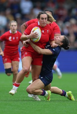 230825 - Wales v Scotland, Women’s Rugby World Cup - Courtney Keight of Wales is tackled