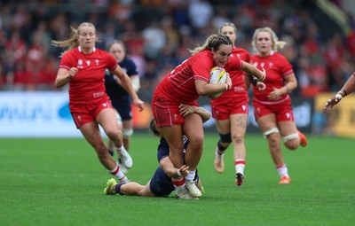 230825 - Wales v Scotland, Women’s Rugby World Cup - Courtney Keight of Wales is tackled