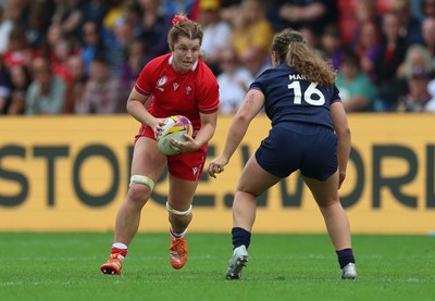 230825 - Wales v Scotland, Women’s Rugby World Cup - Kate Williams of Wales takes on Elis Martin of Scotland