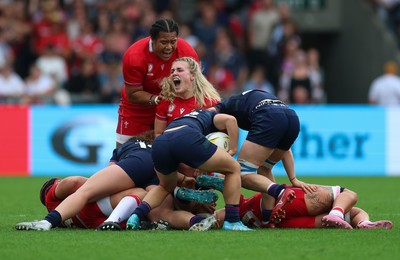 230825 - Wales v Scotland, Women’s Rugby World Cup - Alex Callender of Wales and Sisilia Tuipulotu of Wales react after winning a penalty