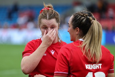 230825 - Wales v Scotland, Women’s Rugby World Cup - Kate Williams of Wales with Courtney Keight of Wales at the end of the match
