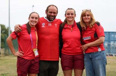 230825 - Wales v Scotland, Women’s Rugby World Cup - Nel Metcalfe of Wales and Branwen Metcalfe of Wales with their parents