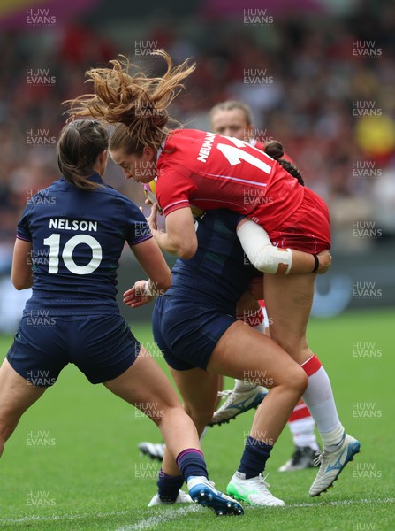 230825 - Wales v Scotland, Women’s Rugby World Cup - Lisa Neumann of Wales is tackled
