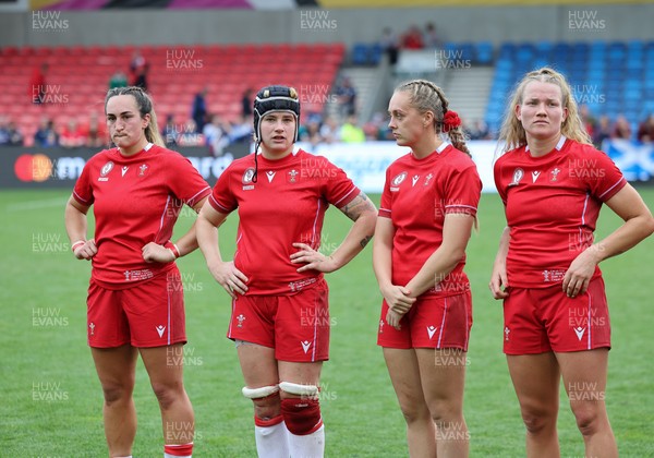 230825 - Wales v Scotland, Women’s Rugby World Cup - Courtney Keight of Wales, Bethan Lewis of Wales, Hannah Dallavalle of Wales and Carys Cox of Wales at the end of the match