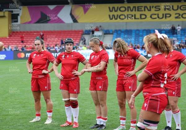 230825 - Wales v Scotland, Women’s Rugby World Cup - Courtney Keight of Wales, Bethan Lewis of Wales, Hannah Dallavalle of Wales and Carys Cox of Wales at the end of the match