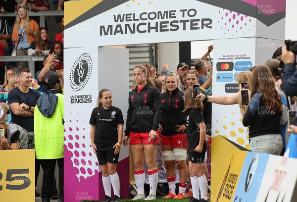 230825 - Wales v Scotland, Women’s Rugby World Cup - Lisa Neumann prepares to lead the team out on her 50th cap
