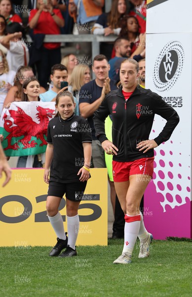 230825 - Wales v Scotland, Women’s Rugby World Cup - Lisa Neumann prepares to lead the team out on her 50th cap