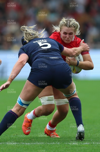 230825 - Wales v Scotland, Women’s Rugby World Cup - Alex Callender of Wales takes on Sarah Bonar of Scotland