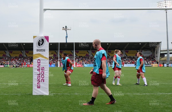 230825 - Wales v Scotland, Women’s Rugby World Cup - Jamie Cox works with the replacements as they warm up