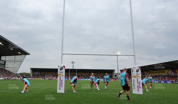 230825 - Wales v Scotland, Women’s Rugby World Cup - Jamie Cox works with the replacements as they warm up