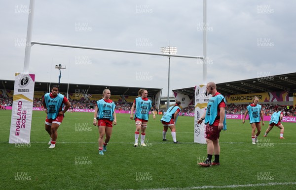 230825 - Wales v Scotland, Women’s Rugby World Cup - Jamie Cox works with the replacements as they warm up