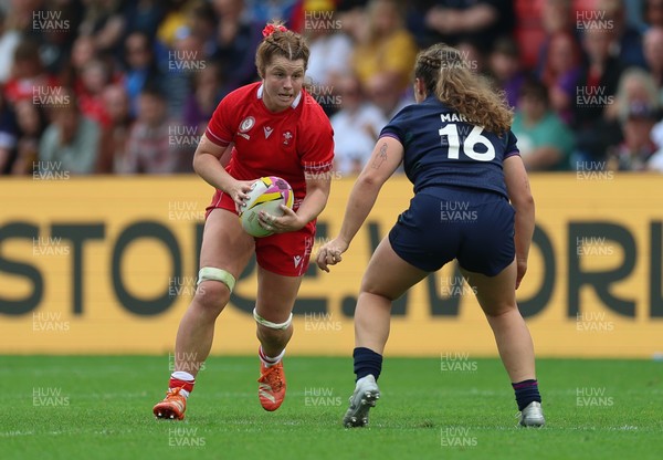 230825 - Wales v Scotland, Women’s Rugby World Cup - Kate Williams of Wales takes on Elis Martin of Scotland