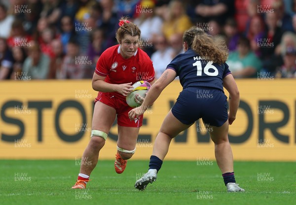230825 - Wales v Scotland, Women’s Rugby World Cup - Kate Williams of Wales takes on Elis Martin of Scotland