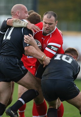 29.10.06...Wales v Scotland Rugby League, Bridgend. Wales' Gareth Price is held by Neil Lowe and Spencer Miller 