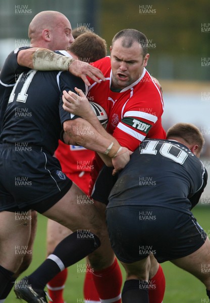 29.10.06...Wales v Scotland Rugby League, Bridgend. Wales' Gareth Price is held by Neil Lowe and Spencer Miller 