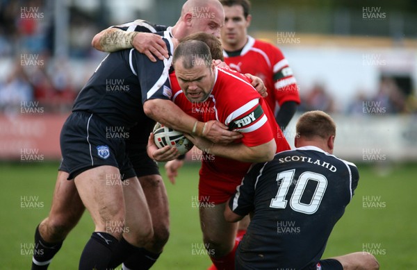 29.10.06...Wales v Scotland Rugby League, Bridgend. Wales' Gareth Price is held by Neil Lowe and Spencer Miller 