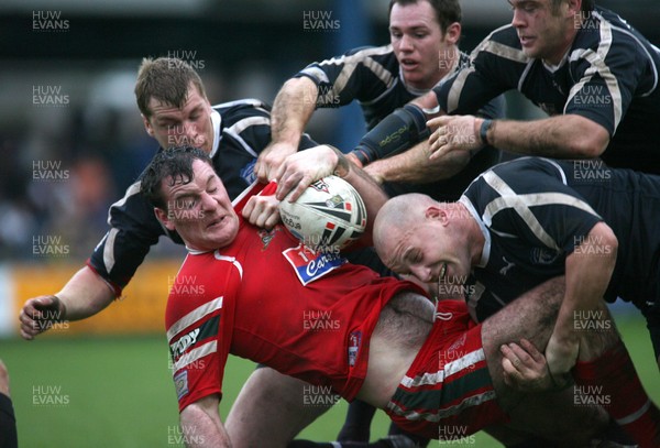 29.10.06...Wales v Scotland Rugby League, Bridgend. Wales' Robert Roberts is overwhelmed by the Scottish defence just short of the try line  