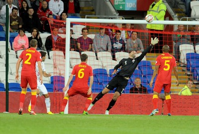 100913 -  Wales v Serbia - FIFA 2014 World Cup Qualifying Match -  Filip Dordevic of Serbia scores a goal( c ) Huw Evans Agency