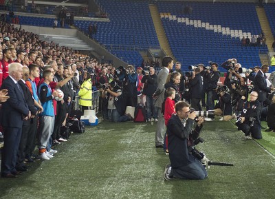 100913 -  Wales v Serbia - FIFA 2014 World Cup Qualifying Match -   Gareth Bale is photographed by a media scrum as he sings the National Anthem( c ) Huw Evans Agency