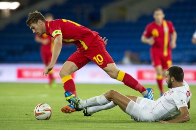 100913 -  Wales v Serbia - FIFA 2014 World Cup Qualifying Match -  Aaropn Ramsey of Wales is tackled by Ivan Radovanovic of Serbia( c ) Huw Evans Agency