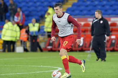 100913 -  Wales v Serbia - FIFA 2014 World Cup Qualifying Match -  Gareth Bale of Wales warms up at half time( c ) Huw Evans Agency