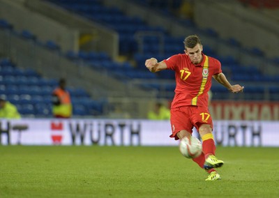 100913 -  Wales v Serbia - FIFA 2014 World Cup Qualifying Match -  Gareth Bale of Wales shoots( c ) Huw Evans Agency