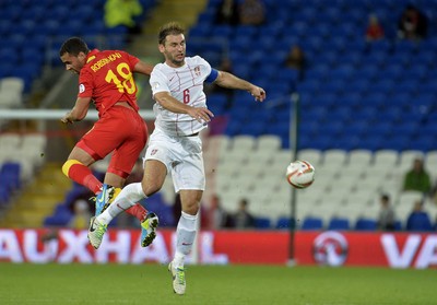 100913 -  Wales v Serbia - FIFA 2014 World Cup Qualifying Match -   Hal Robson Kanu of Wales looses the ball to an aerial challenge by Branslav Ivanovic of Serbia( c ) Huw Evans Agency