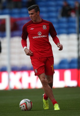 100913 - Wales v Serbia, FIFA 2014 World Cup Qualifying - Wales' Gareth Bale, who starts the match on the bench, warms up before the match(c) Huw Evans Picture Agency, Cardiff
