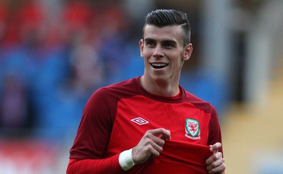 100913 - Wales v Serbia, FIFA 2014 World Cup Qualifying - Wales' Gareth Bale, who starts the match on the bench, warms up before the match(c) Huw Evans Picture Agency, Cardiff