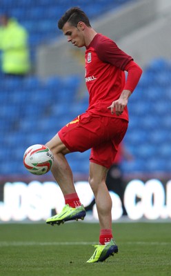 100913 - Wales v Serbia, FIFA 2014 World Cup Qualifying - Wales' Gareth Bale, who starts the match on the bench, warms up before the match(c) Huw Evans Picture Agency, Cardiff