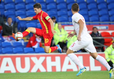 100913 - Wales v Serbia, FIFA 2014 World Cup Qualifying - Wales' Aaron Ramsey wins the ball as Serbia's Matija Nastasic closes in- (c) Huw Evans Picture Agency, Cardiff