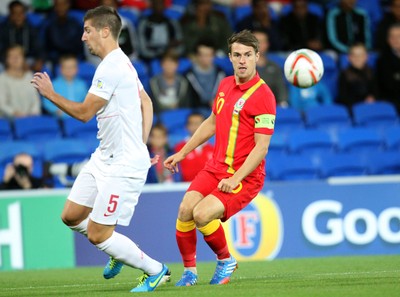 100913 - Wales v Serbia, FIFA 2014 World Cup Qualifying - Wales' Aaron Ramsey wins the ball as Serbia's Matija Nastasic closes in- (c) Huw Evans Picture Agency, Cardiff