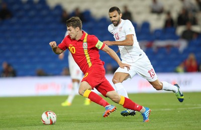100913 - Wales v Serbia, FIFA 2014 World Cup Qualifying - Wales' Aaron Ramsey gets away from Serbia's Ivan Radovanovic- (c) Huw Evans Picture Agency, Cardiff