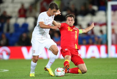 100913 - Wales v Serbia, FIFA 2014 World Cup Qualifying - Wales' Aaron Ramsey challenges Serbia's Filip Duricic- (c) Huw Evans Picture Agency, Cardiff