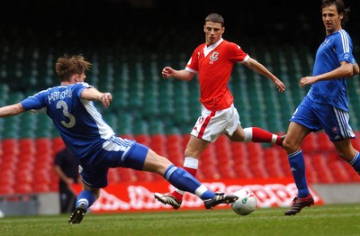 07.10.06 - Euro 2008 Qualifying Match, Group D Wales v Slovakia Wales' Jason Koumas tries to get the ball past Roman Kratochvil (3) 