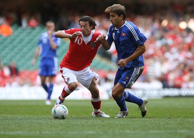 07.10.06...Wales v Slovakia, Euro 2008 Qualifying Match, Cardiff Wales' Simon Davies holds off Martin Petras 