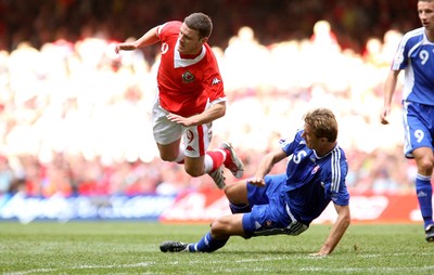 07.10.06...Wales v Slovakia, Euro 2008 Qualifying Match, Cardiff Wales' Jason Koumas is brought down by Stanislav Varga 