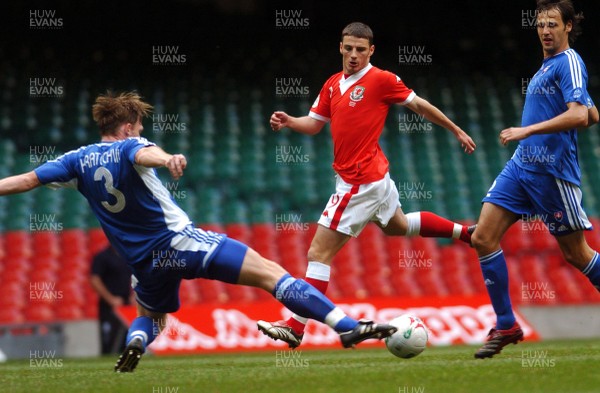 07.10.06 - Euro 2008 Qualifying Match, Group D Wales v Slovakia Wales' Jason Koumas tries to get the ball past Roman Kratochvil (3) 